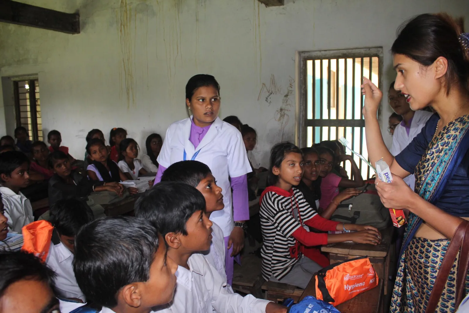 A health educator speaks with students in a classroom
